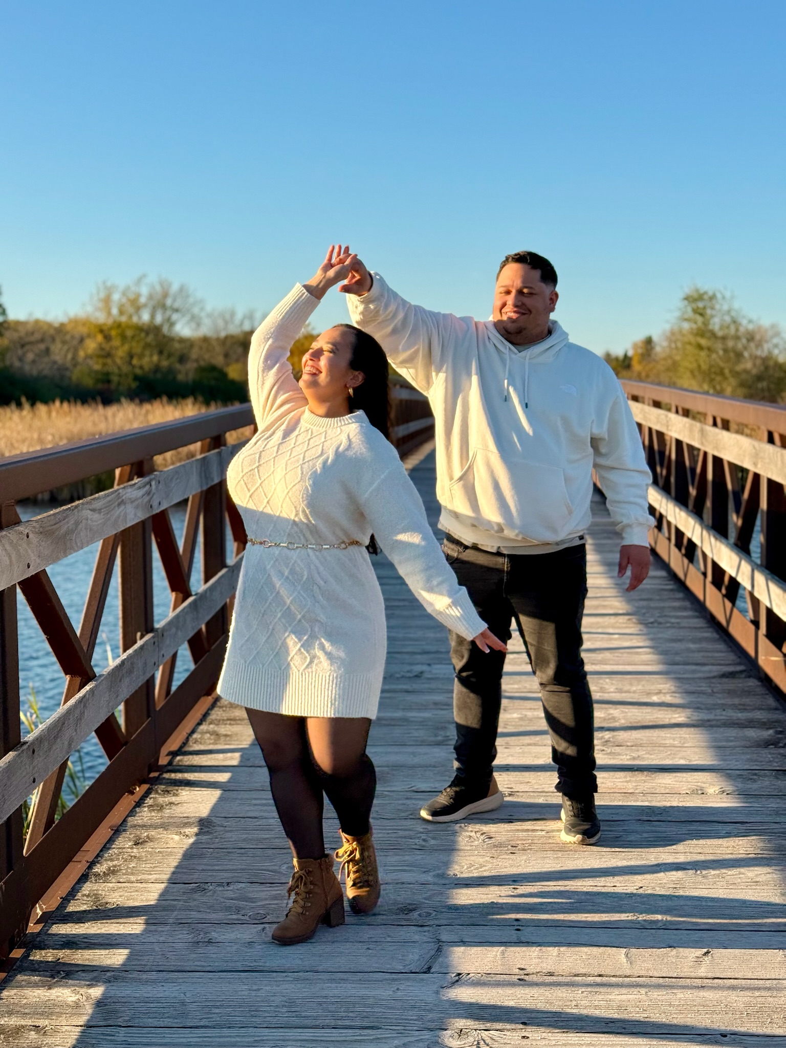 Emelie and Francesco on a wooden bridge