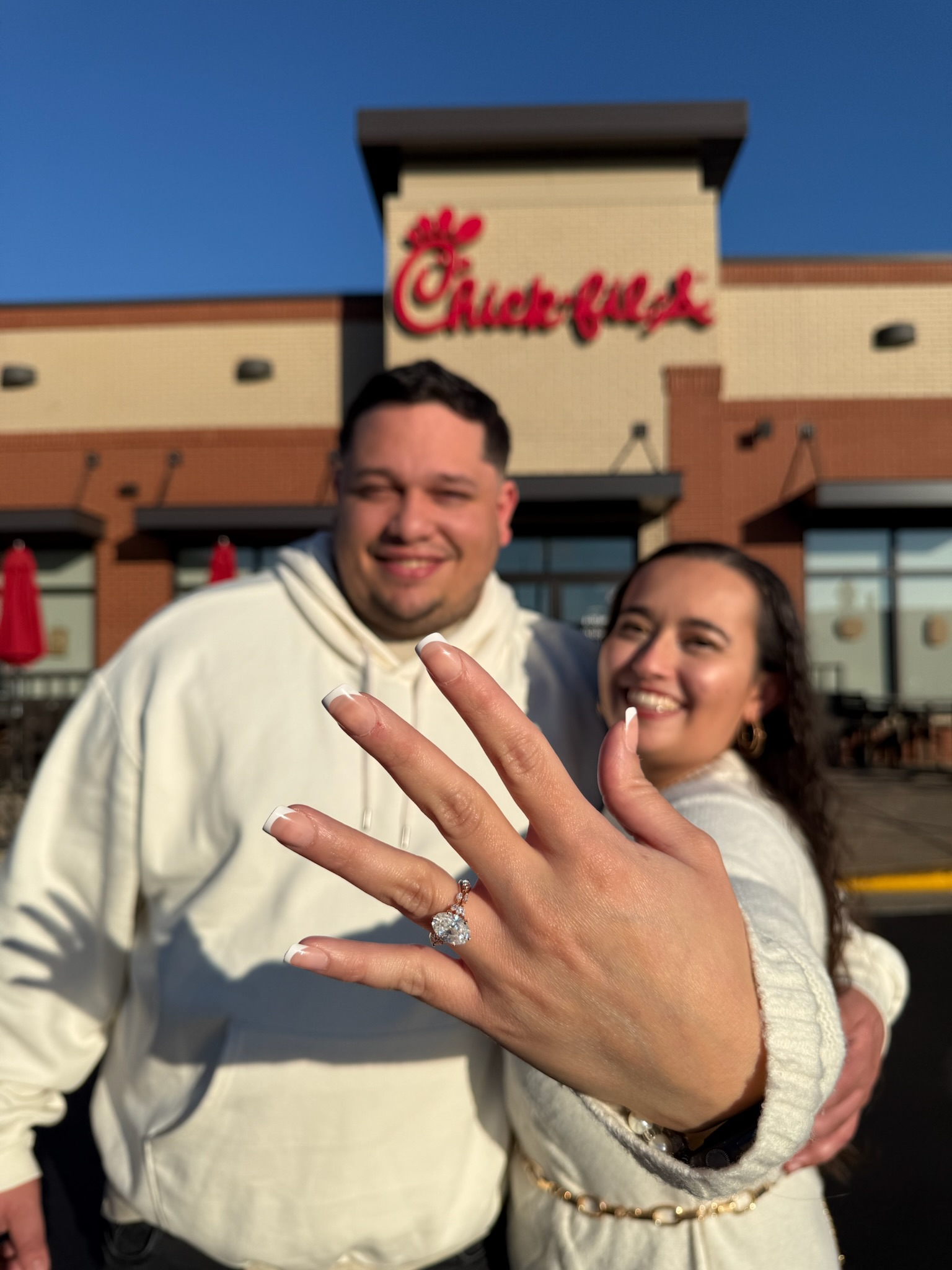 Emelie and Francesco showing the engagement ring